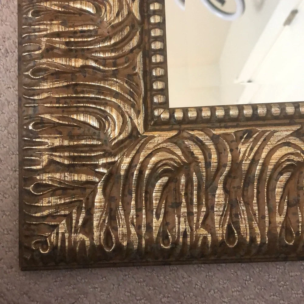 Wood framed mirror in gold